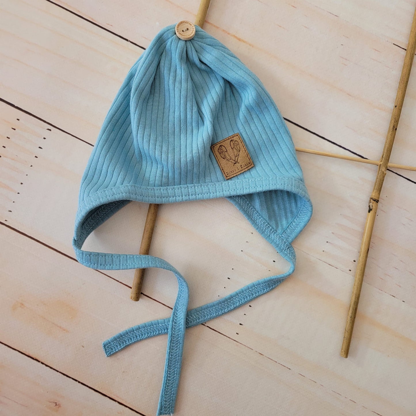 Gombos rugdalózó + megkötős sapka – 2 részes szett, világoskék